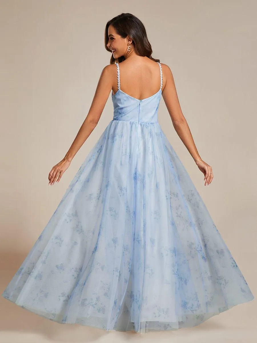 Robe de soirée florale à bretelles spaghetti et taille empire avec col en V