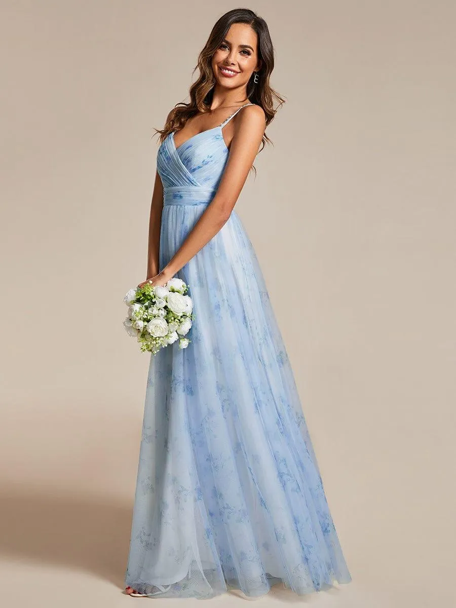 Robe de soirée florale à bretelles spaghetti et taille empire avec col en V
