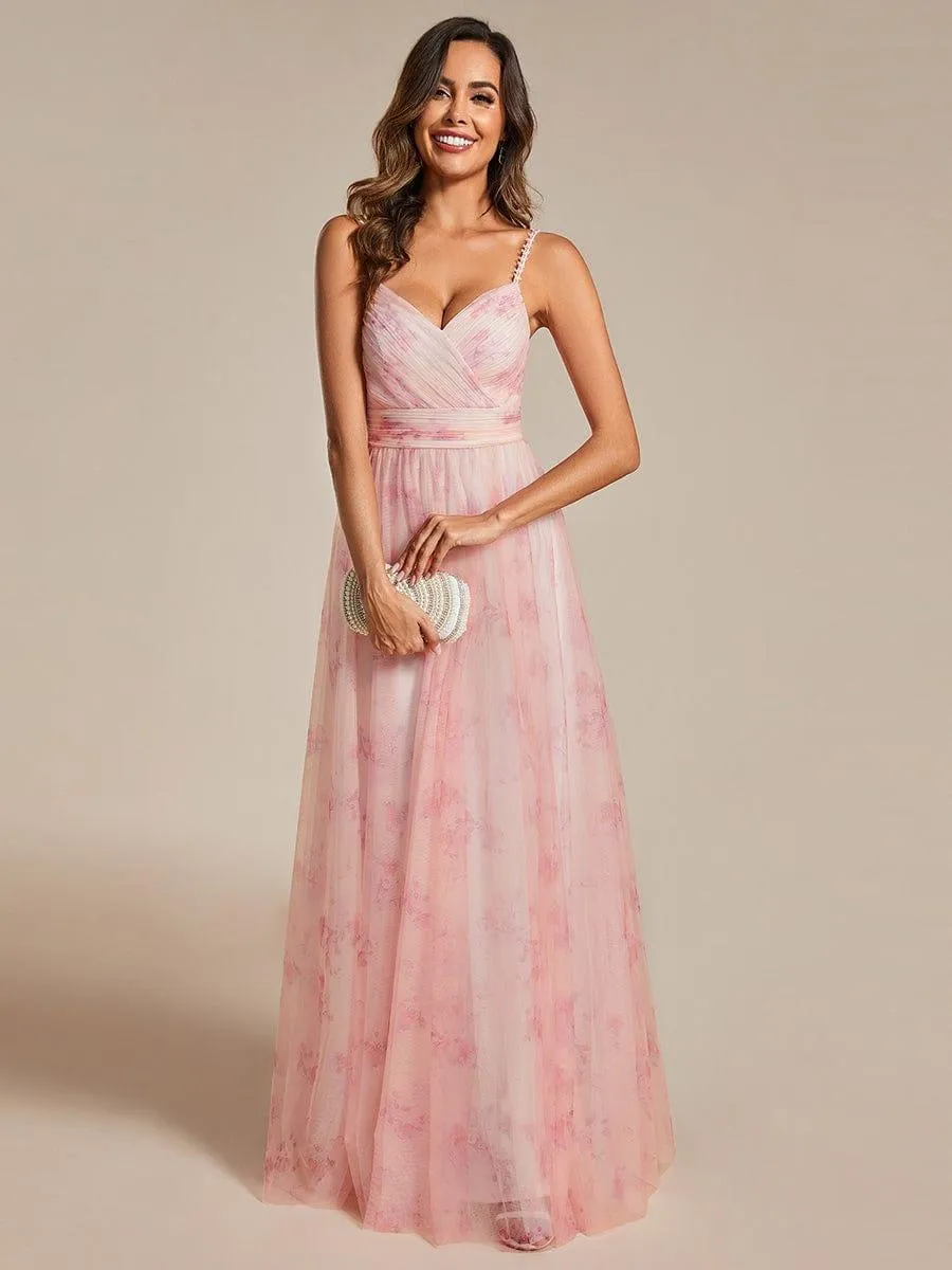 Robe de soirée florale à bretelles spaghetti et taille empire avec col en V