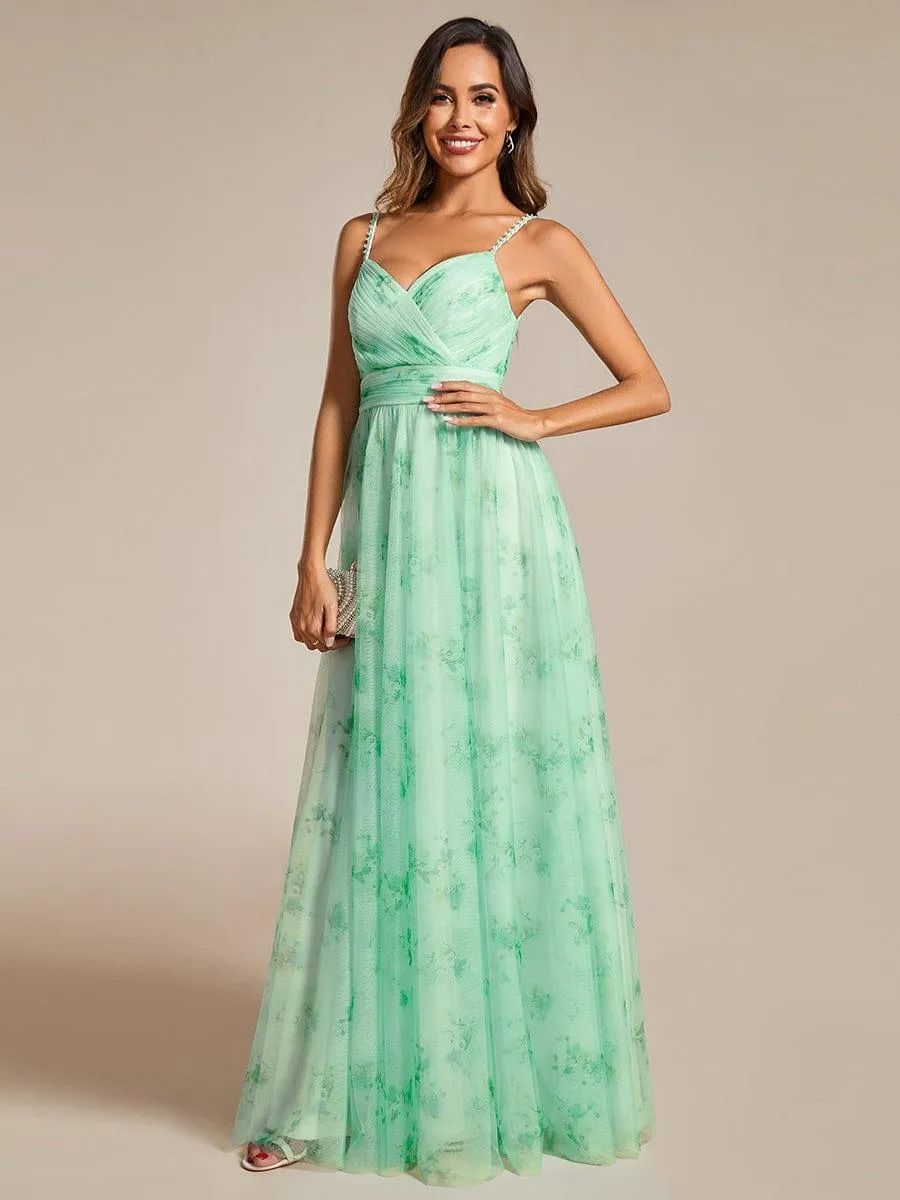 Robe de soirée florale à bretelles spaghetti et taille empire avec col en V
