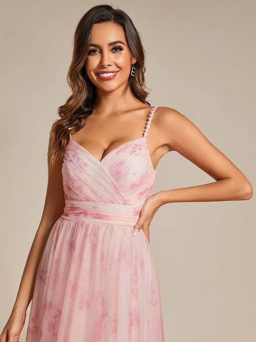 Robe de soirée florale à bretelles spaghetti et taille empire avec col en V