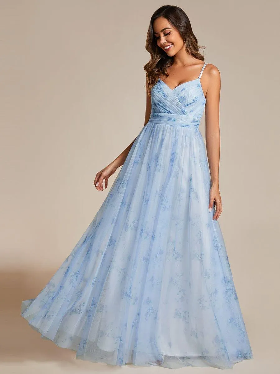 Robe de soirée florale à bretelles spaghetti et taille empire avec col en V