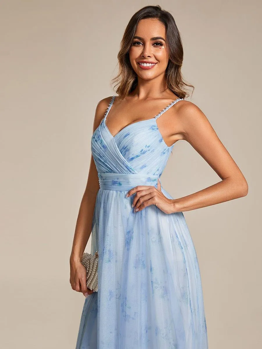 Robe de soirée florale à bretelles spaghetti et taille empire avec col en V