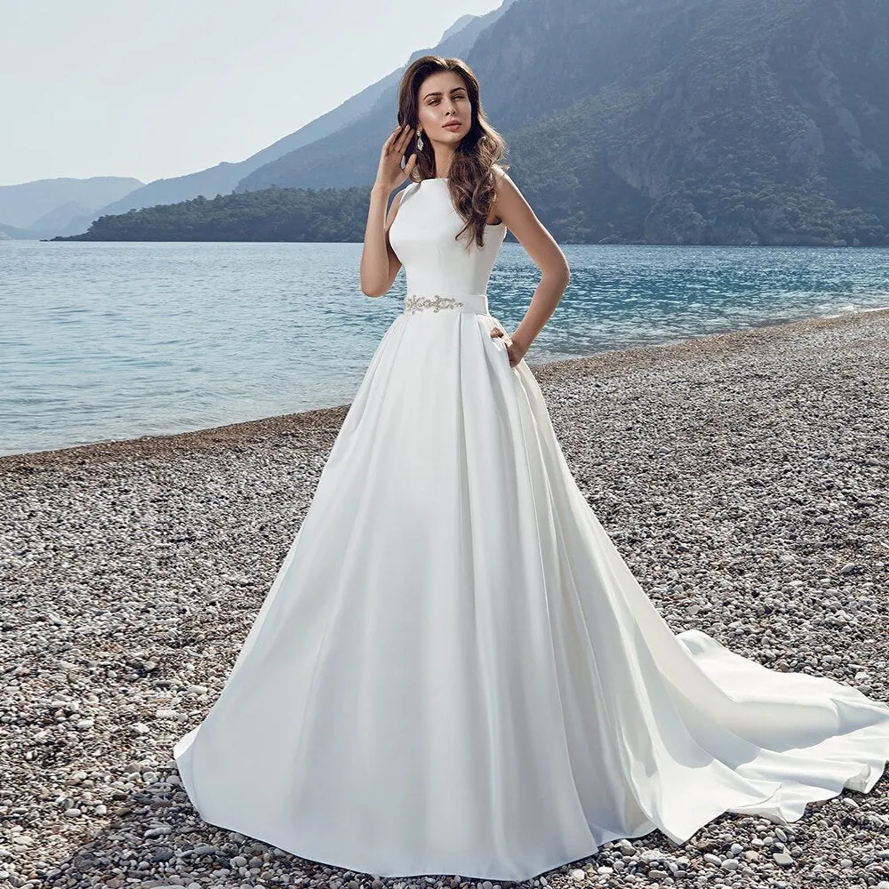 Satin Wedding Dresses With Pockets Robe Mariage See Through Appliques Buttons Up Back Beading Crystal Waist White Gowns Gelinlik